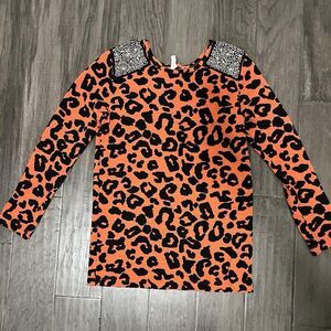 Orange and black cheetah print long sleeve top